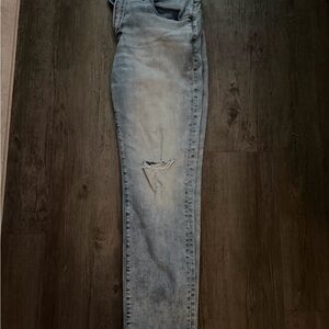 American Eagle Outfitters Light Blue Skinny Jeans with Knee Rip